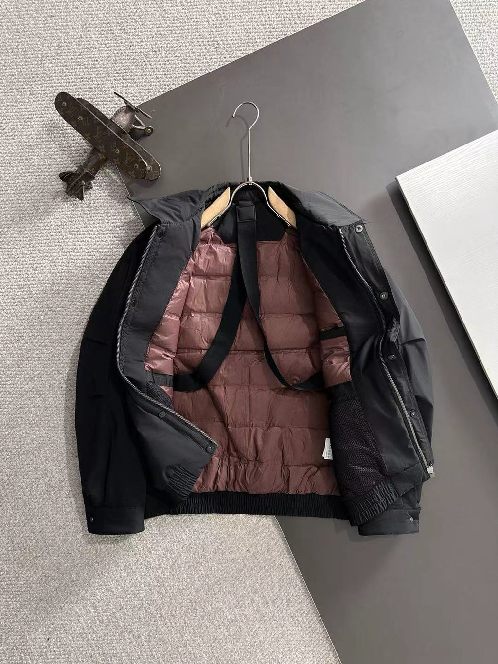 Dior long black jacket interior lining with quilted burgundy panel