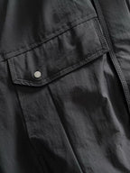 Dior long black jacket front with snap button flap pocket and stitched panel seams