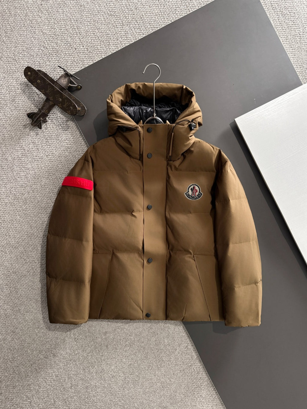 Moncler long puffer jacket with attached hood, front button closure, tan
