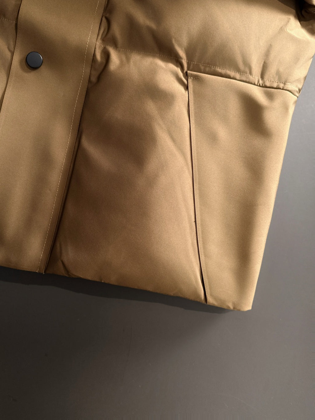 Moncler long puffer jacket lower front with dark buttons and side seam