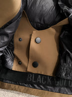Moncler puffer jacket front placket with black interior lining and snap buttons