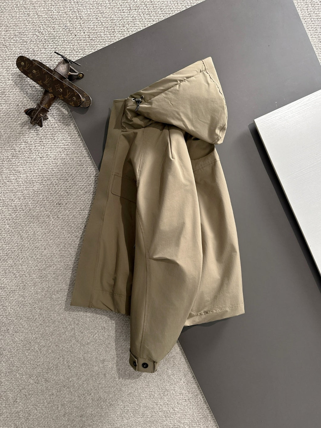 Fendi long hooded parka in light tan with adjustable hood and front closure