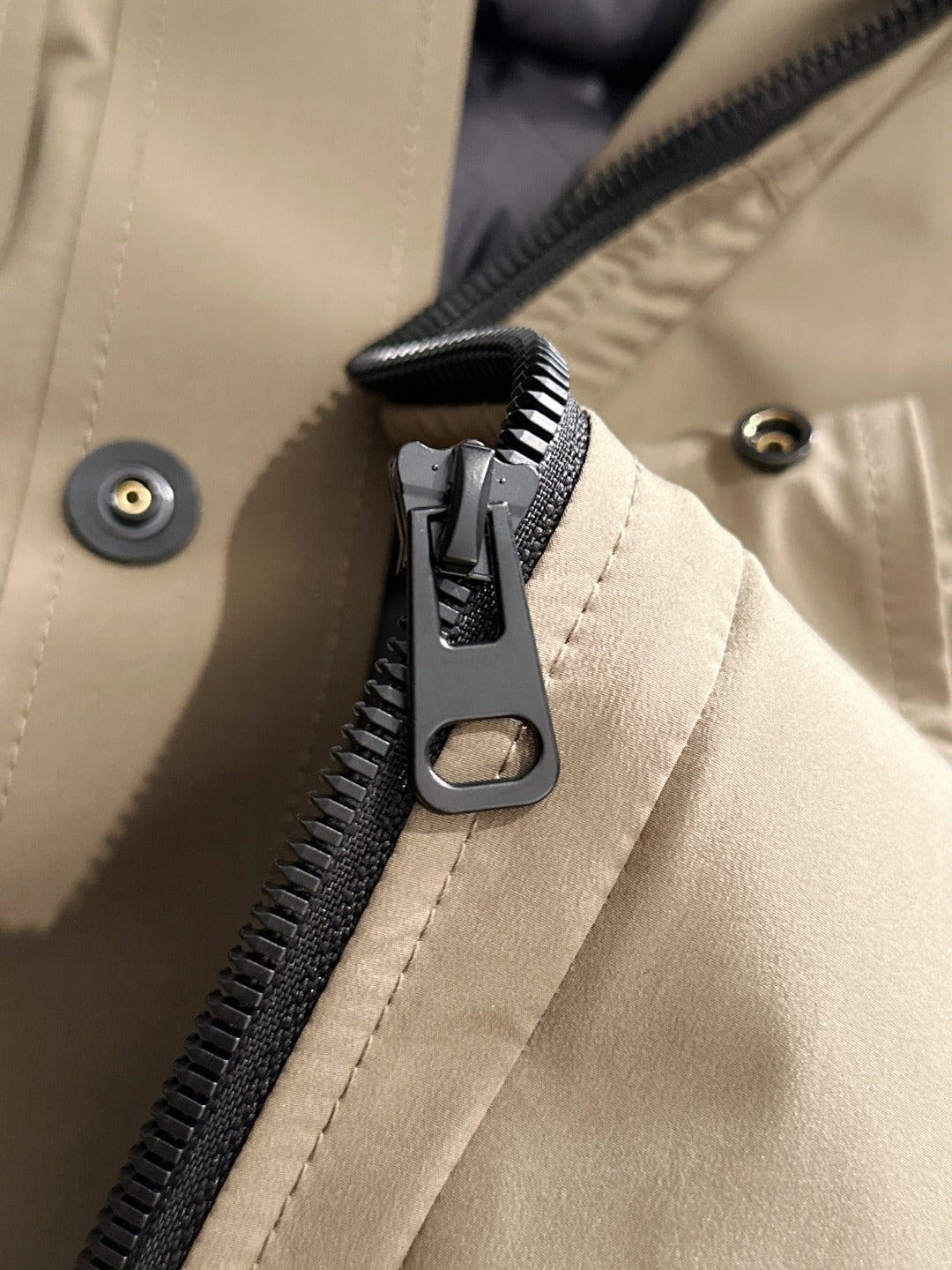 Fendi parka zipper placket detail with metal pull and dark zip track