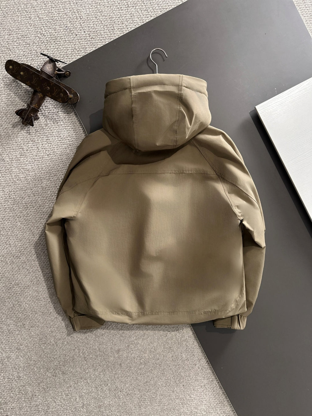 Fendi hooded long parka in light tan with gathered hood and curved back
