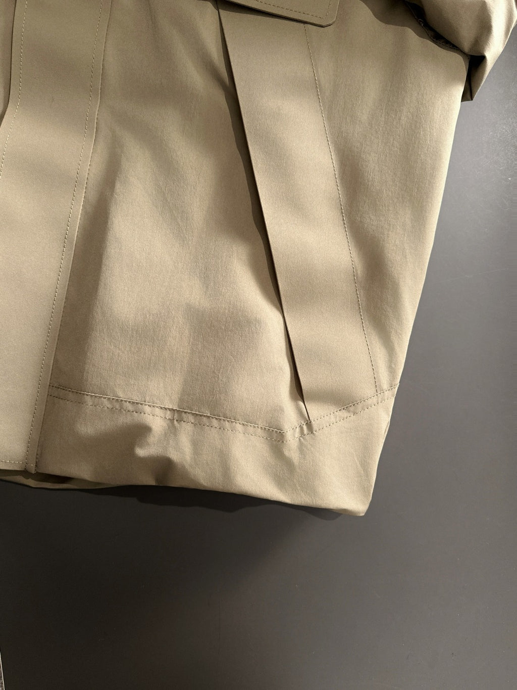 Fendi parka jacket in light tan with side panel seams and hem vent