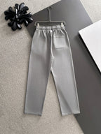 Stone Island light gray sweatpants with logo patch, elastic waist, and straight leg fit