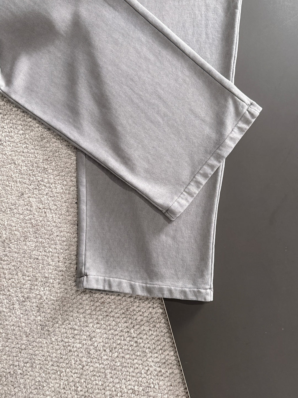 Stone Island light gray sweatpants with folded hem and visible side seam