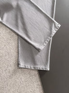 Stone Island light gray sweatpants with folded hem and visible side seam