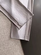 Light gray pants cuff and side seam close-up
