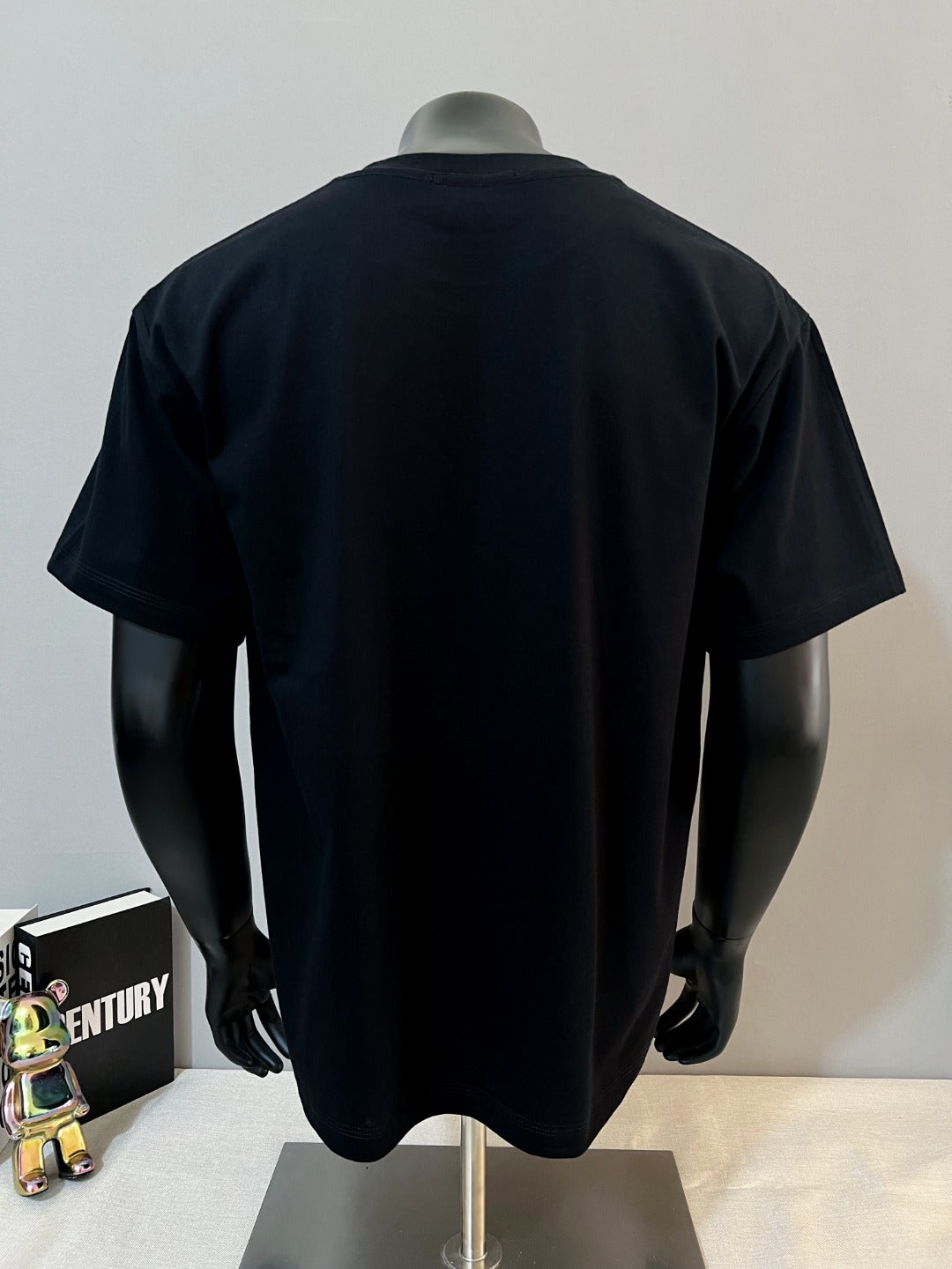Black Gucci T-shirt back view on mannequin, crew neck and short sleeves