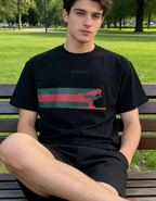 Black Gucci T-shirt worn by model with red and green graphic stripe, crew neck