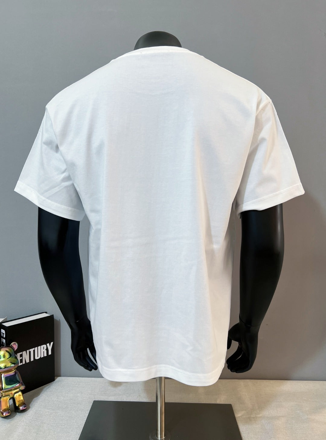 White Gucci T-shirt back view, plain with short sleeves and crew neckline