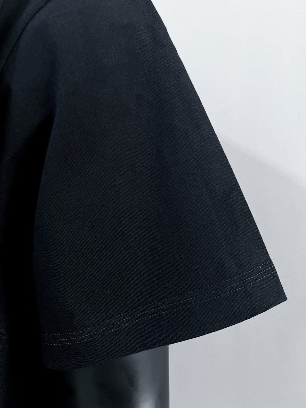 Givenchy black T-shirt sleeve and hem stitching detail