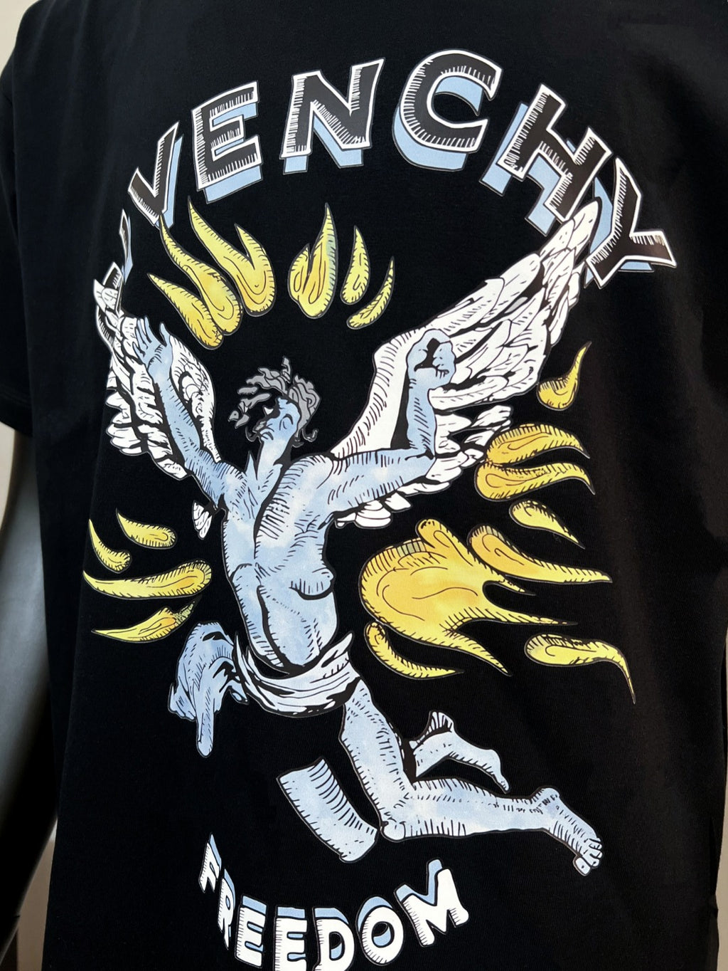 Givenchy black T-shirt close-up of flame angel graphic and GIVENCHY text