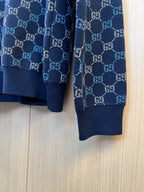 Dark blue Gucci knit sleeve with GG monogram pattern and ribbed cuff