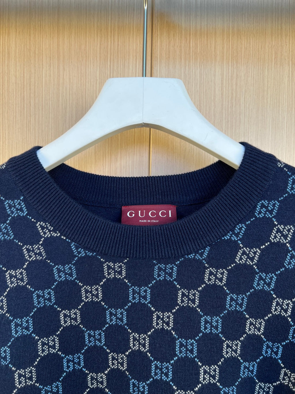 Dark blue Gucci knit sweater neckline with GG monogram pattern and ribbed collar