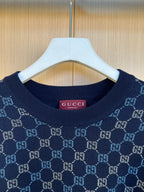 Dark blue Gucci knit sweater neckline with GG monogram pattern and ribbed collar