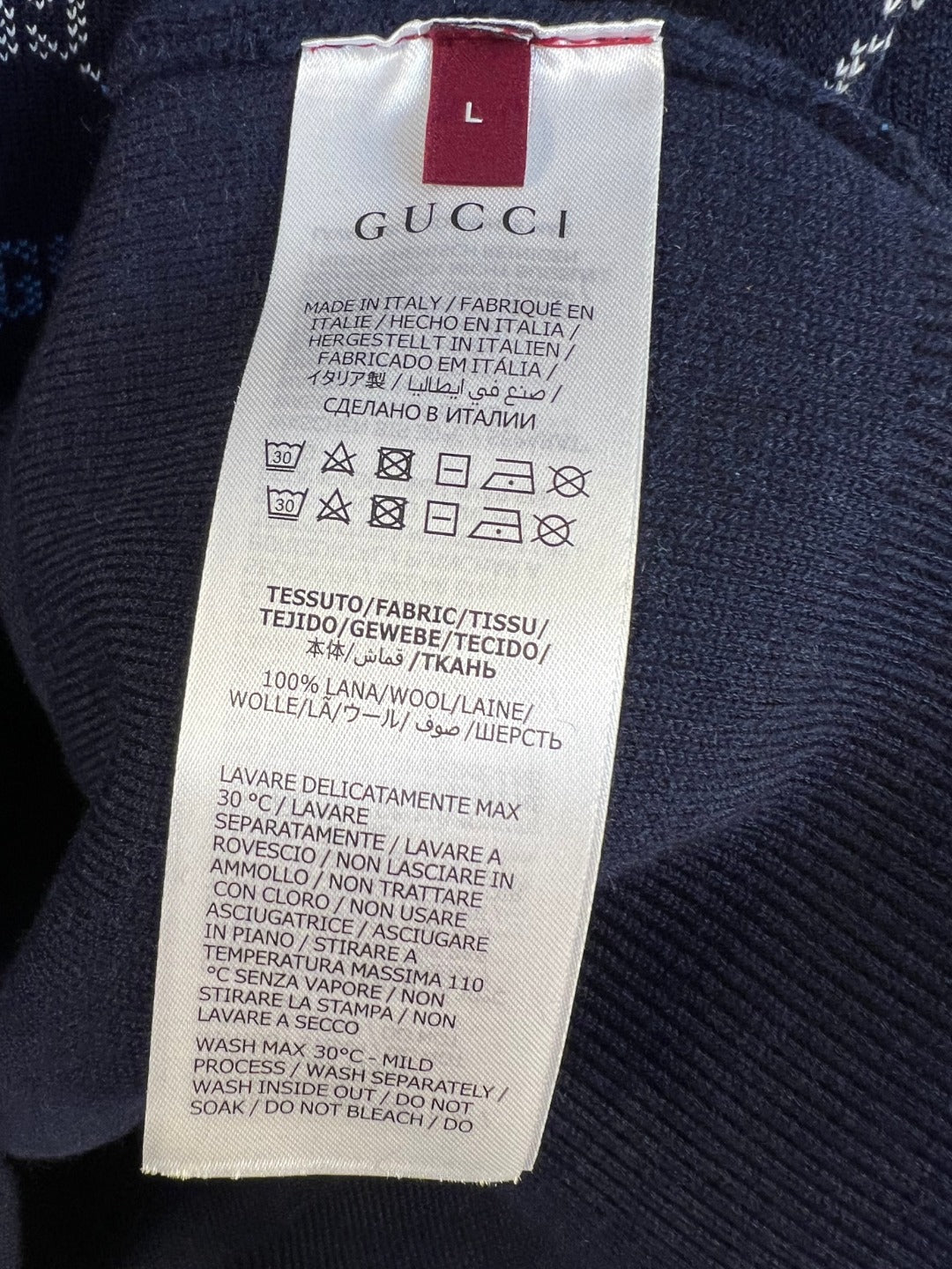 Gucci knit sweater care label, size L, on inside neck