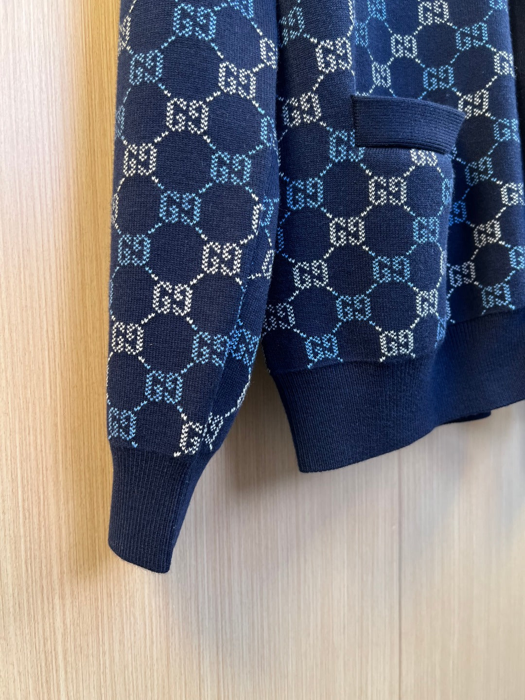 Gucci knit cardigan sleeve and hem detail, navy GG monogram pattern cuff