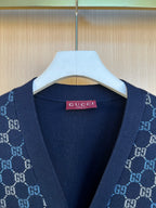 Gucci knit cardigan neckline close-up with pink brand label and GG pattern