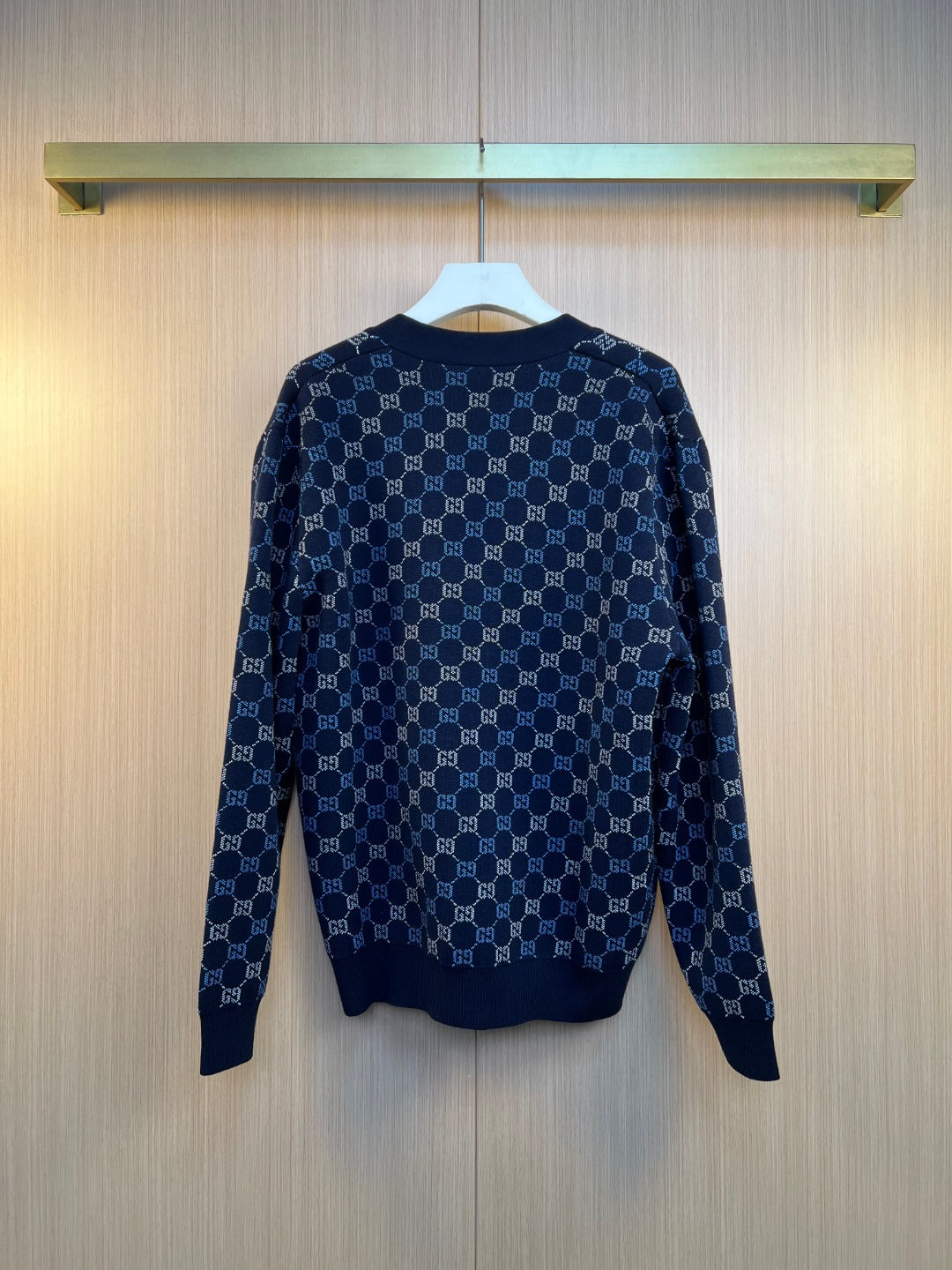 Gucci knit cardigan back view with navy GG monogram pattern