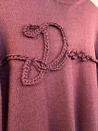 Burgundy sweater front with heart-shaped braided embroidery