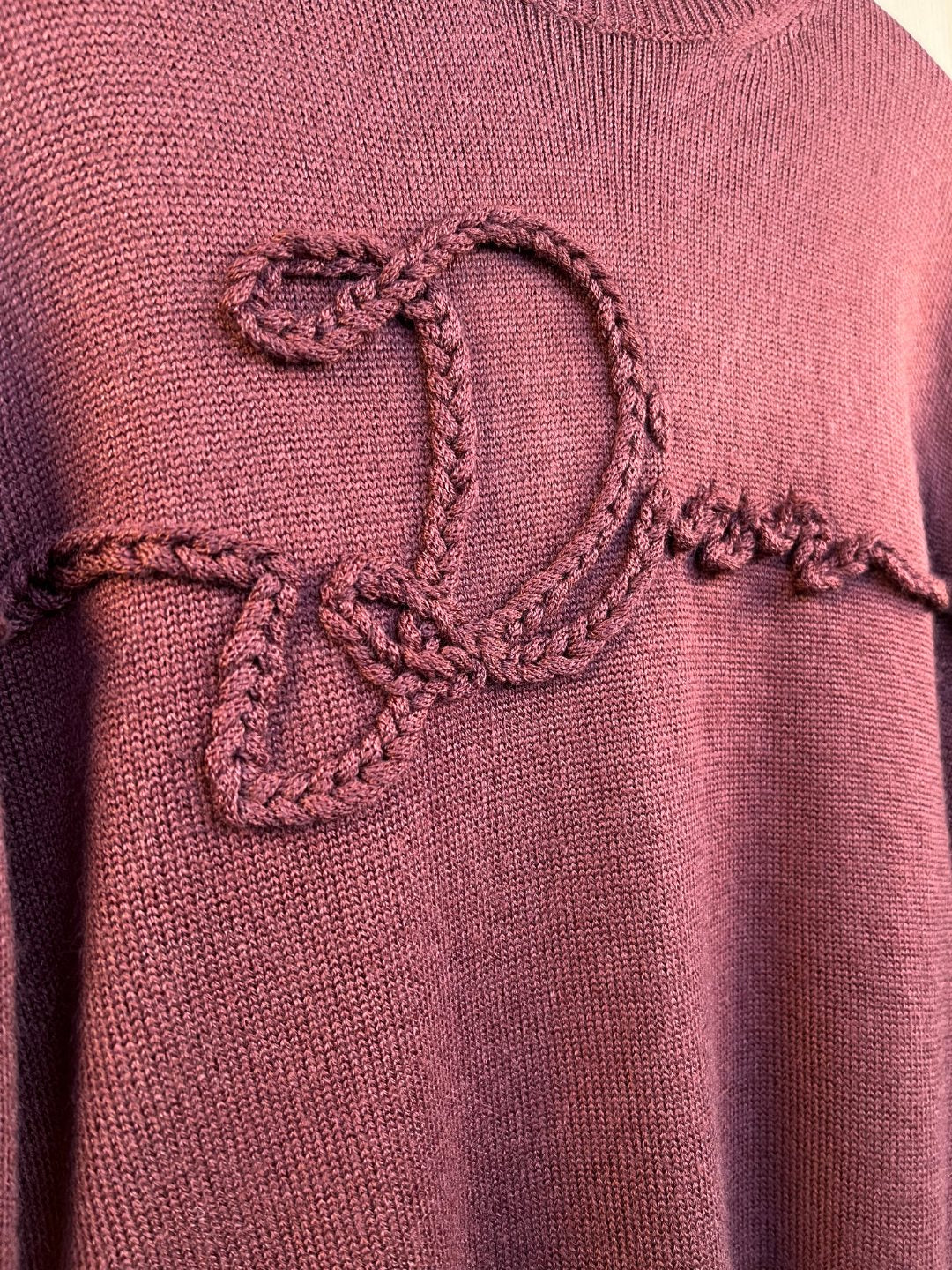 Burgundy sweater front with heart-shaped braided embroidery