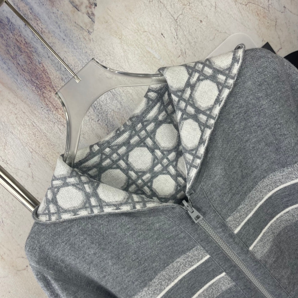 Gray zip hoodie front detail with geometric lattice print and hood