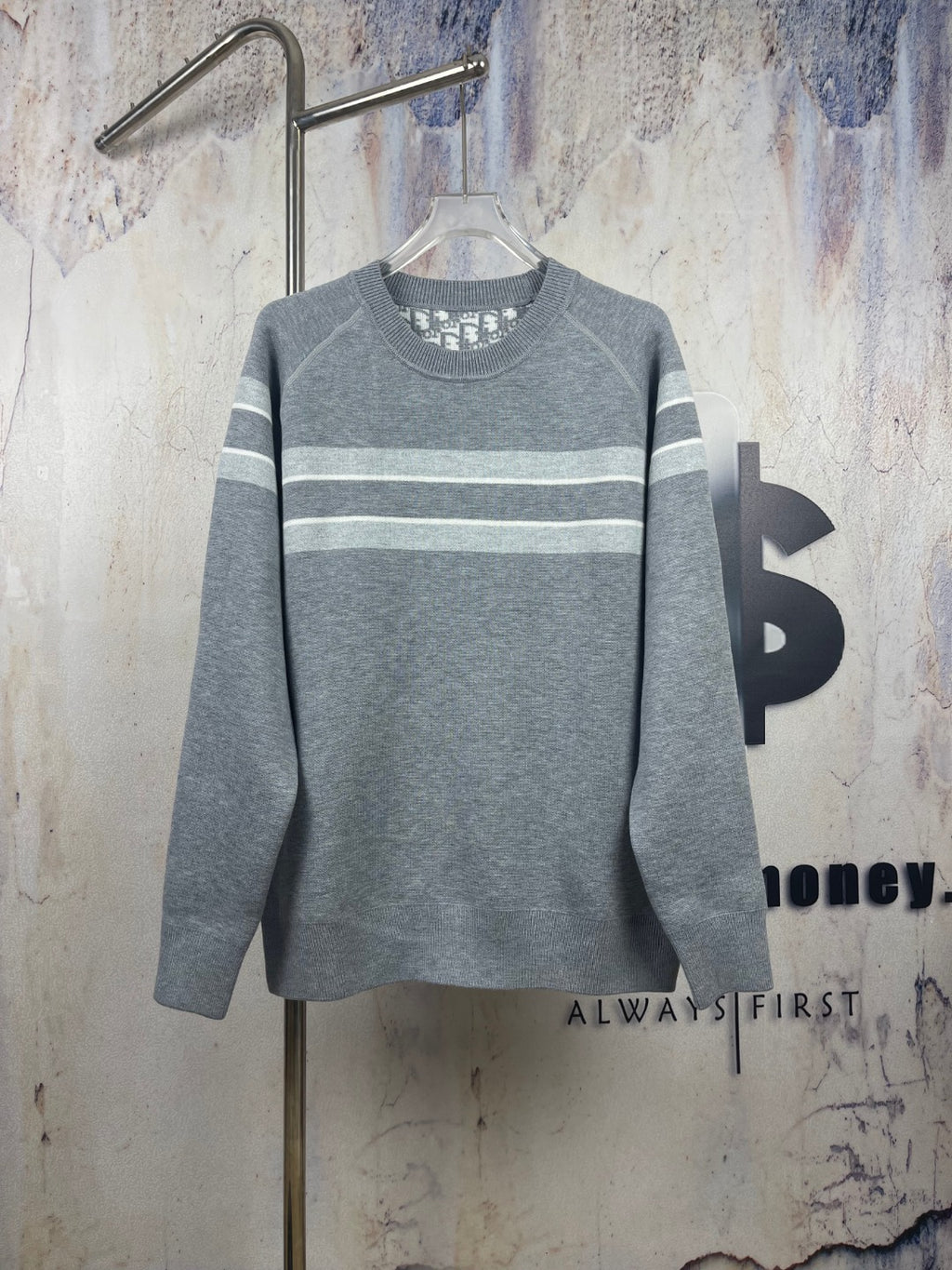 Long-sleeve crewneck sweater in gray with horizontal stripe bands, ribbed collar and cuffs