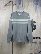 Long-sleeve crewneck sweater in gray with horizontal stripe bands, ribbed collar and cuffs