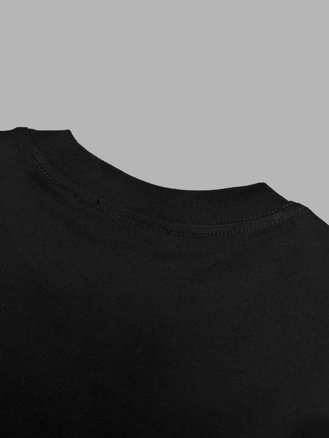 Black crewneck T-shirt with faint front text print