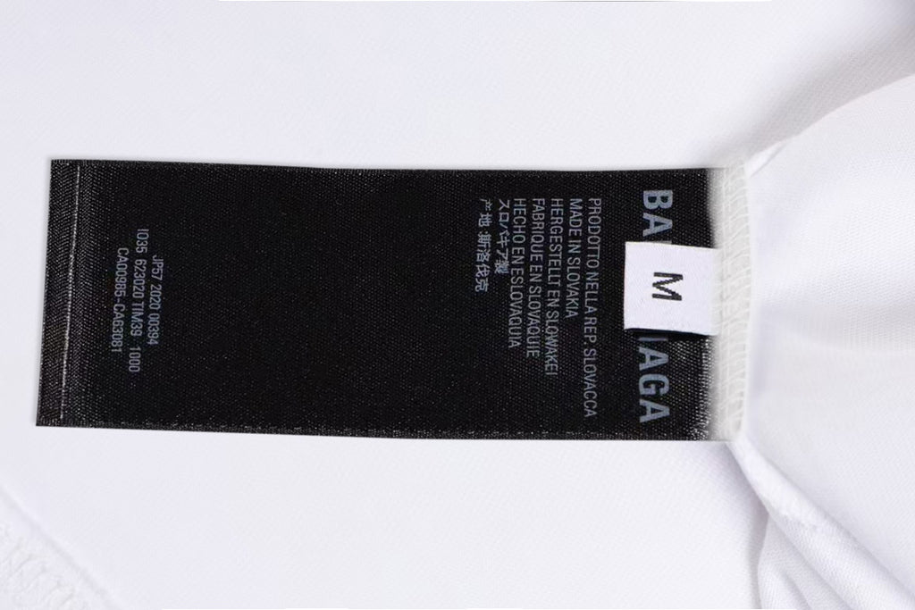 White T-shirt collar label detail with size info and BALENCIAGA