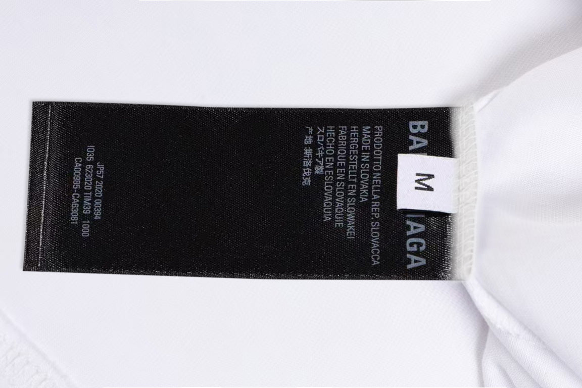White T-shirt collar label detail with size info and BALENCIAGA
