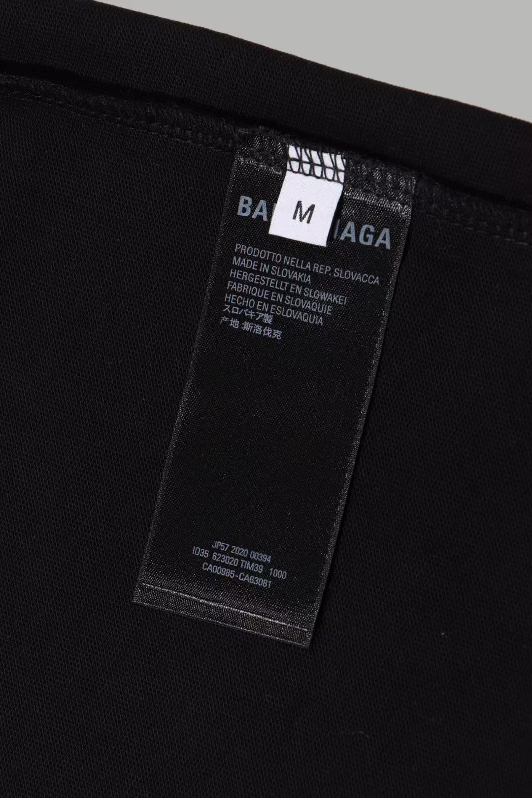 Black Balenciaga T-shirt inside care label and size tag detail