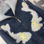 Louis Vuitton knit zip jacket close-up with white, yellow, and pink floral intarsia