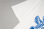 White T-shirt sleeve detail with blue FENDI logo graphic