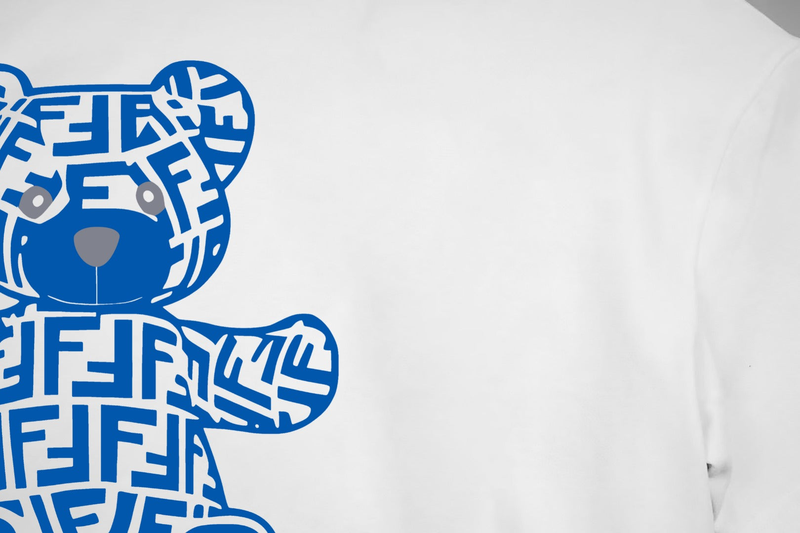 White T-shirt front detail of blue teddy graphic print