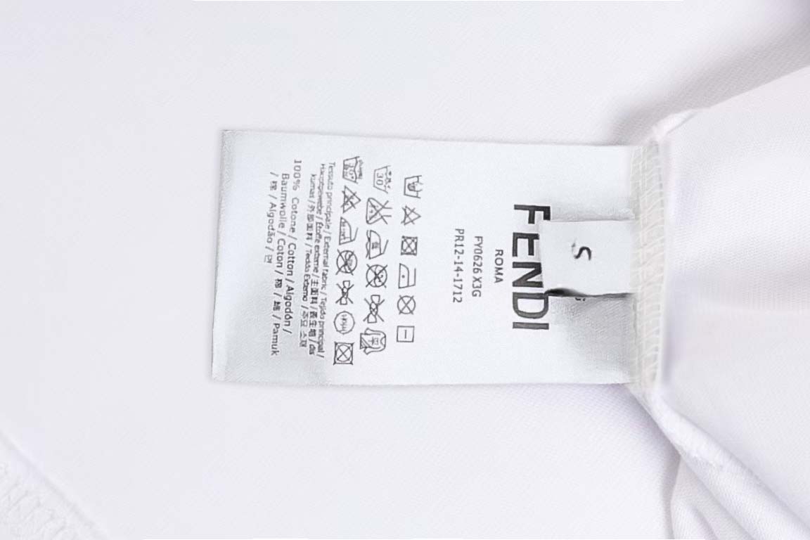 White T-shirt care label with Fendi tag near collar