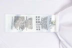 White Gucci T-shirt interior care label with size markings near collar