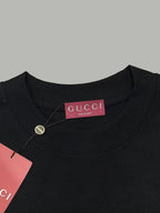 Black Gucci T-shirt neckline with GUCCI label tag