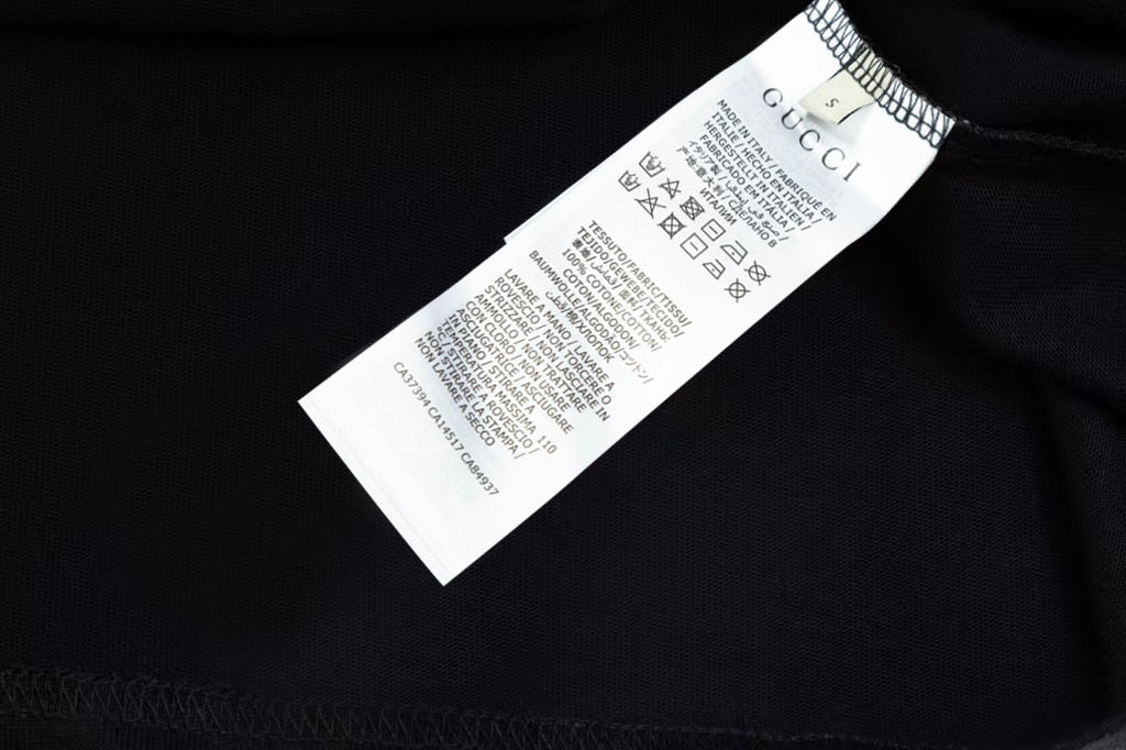 Black Gucci T-shirt with white care label inside collar