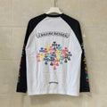 White and black long-sleeve raglan T-shirt with floral cross graphic on front
