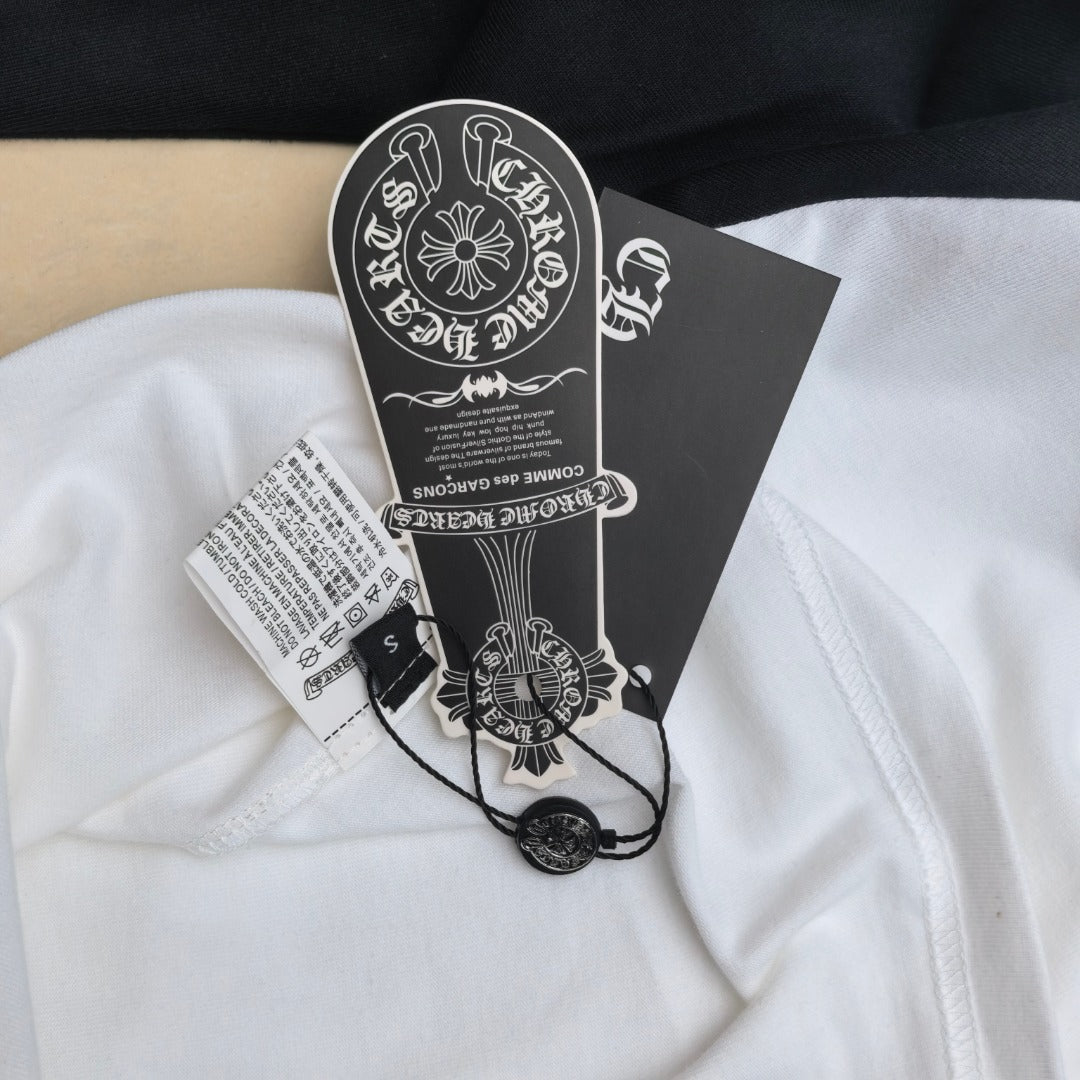 White and black raglan T-shirt with attached hang tags and barcode label.