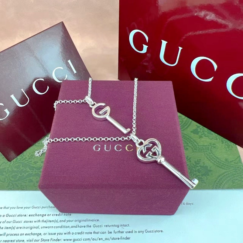 Gucci key pendant necklace and clasp chain, silver-tone with G charm on box