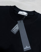 Black Stone Island T-shirt with neck label and hanging tags