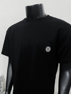 Black short-sleeve T-shirt with crew neck and small chest logo patch