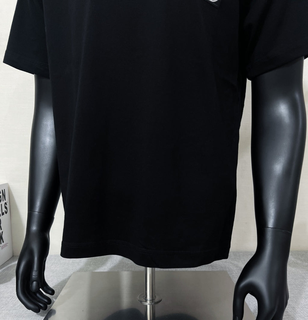 Black short-sleeve T-shirt on mannequin, front lower view