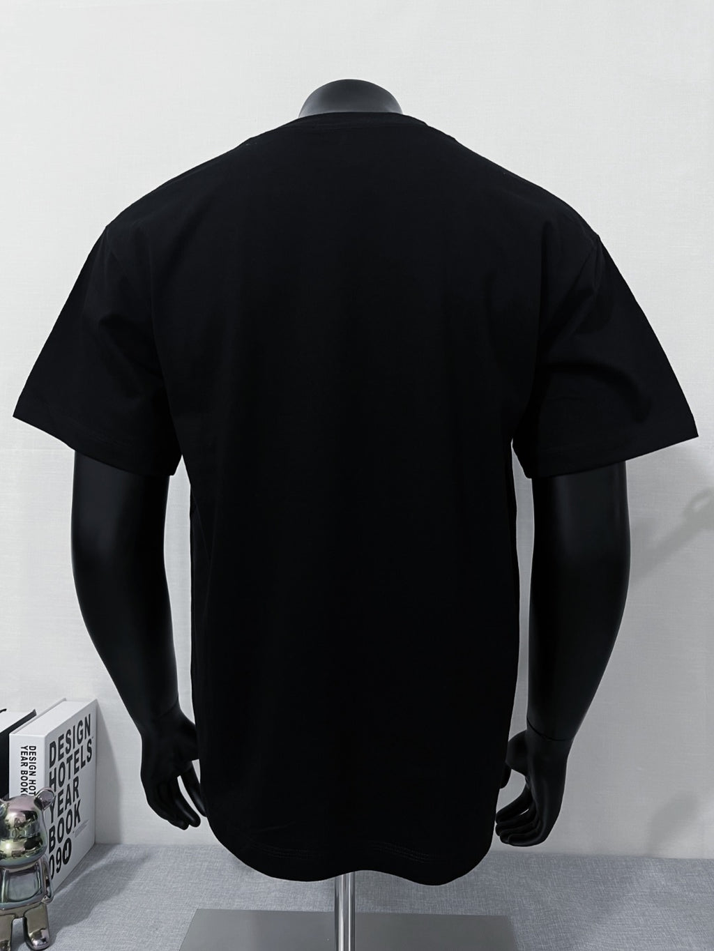 Black short-sleeve T-shirt with back view on mannequin