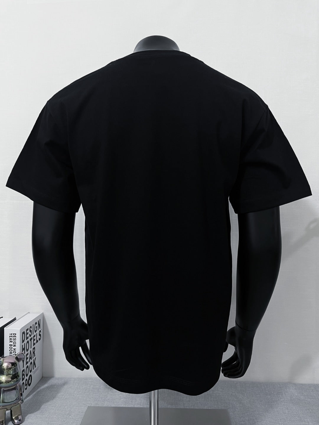 Black short-sleeve T-shirt with back view on mannequin