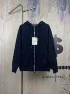 Navy zip-up hooded jacket with drawstring hood and front zipper